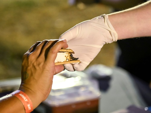 A camper grabs a s'more