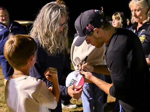 Santino Ferrucci signs an autograph